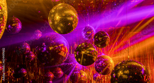 disco background with golden and purple rays of mirror balls