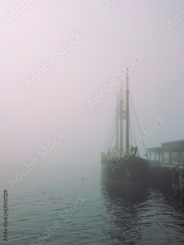 Halifax Harbor foggy morning with a moored boat in Nova Scotia,