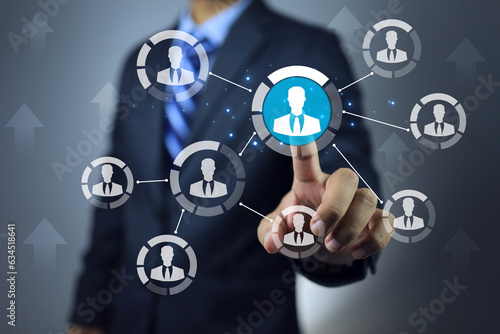 Businessman pointing on team leader to promote or assign the important mission to distribute in projectmanagement co working team as window person to report task or jobs progression to manager photo