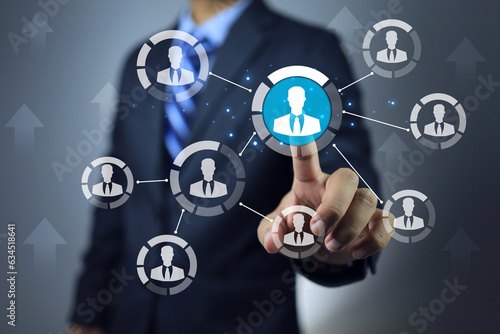 Businessman pointing on team leader to promote or assign the important mission to distribute in projectmanagement co working team as window person to report task or jobs progression to manager