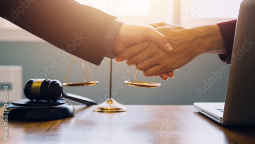 Canvas Print Businessman shaking hands to seal a deal with his partner lawyers or attorneys d