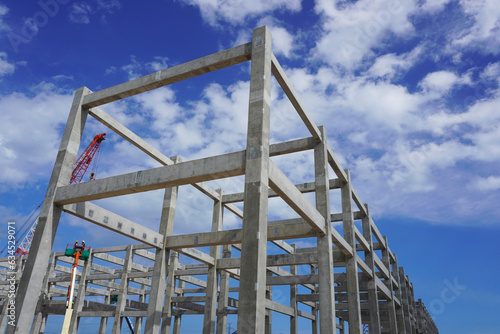 Precast concrete structures building installation at construction site on oil and gas plant.