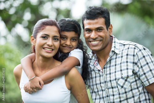 Happy Indian family at the park.