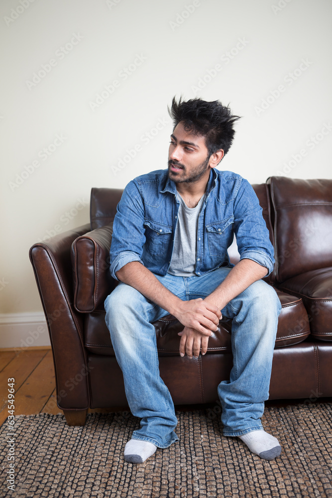 Indian man relaxing at home. Indian man relaxing at home.