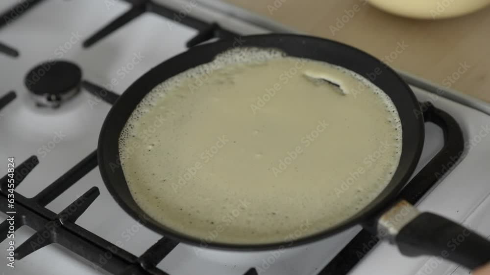 Cooking pancakes for breakfast on a gas stove Cooking pancakes for breakfast on a gas stove