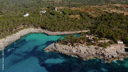 Scenic View Of Rocky Cliffs On The Cove Beach Of Caló des Borgit In Mallorca, Spain. Aerial Drone Shot
 photo