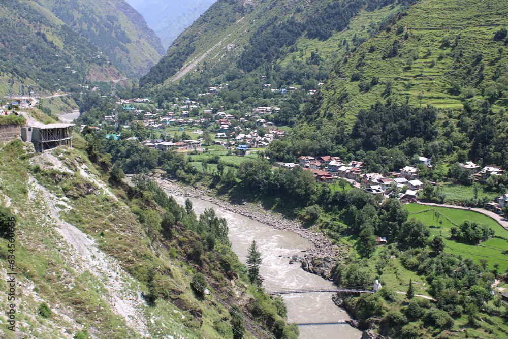 Beautiful day time view of Keran Valley, Neelam Valley, Kashmir. Green valleys, high mountains and trees are visible.