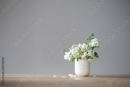 white summer flowers on gray background