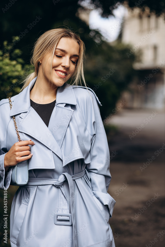 Fototapeta premium Portrait of beautiful woman walking in park