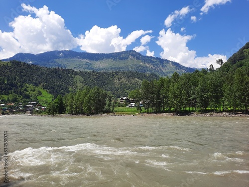 Beautiful day time view of Keran Valley, Neelam Valley, Kashmir. Green valleys, high mountains and trees are visible. photo