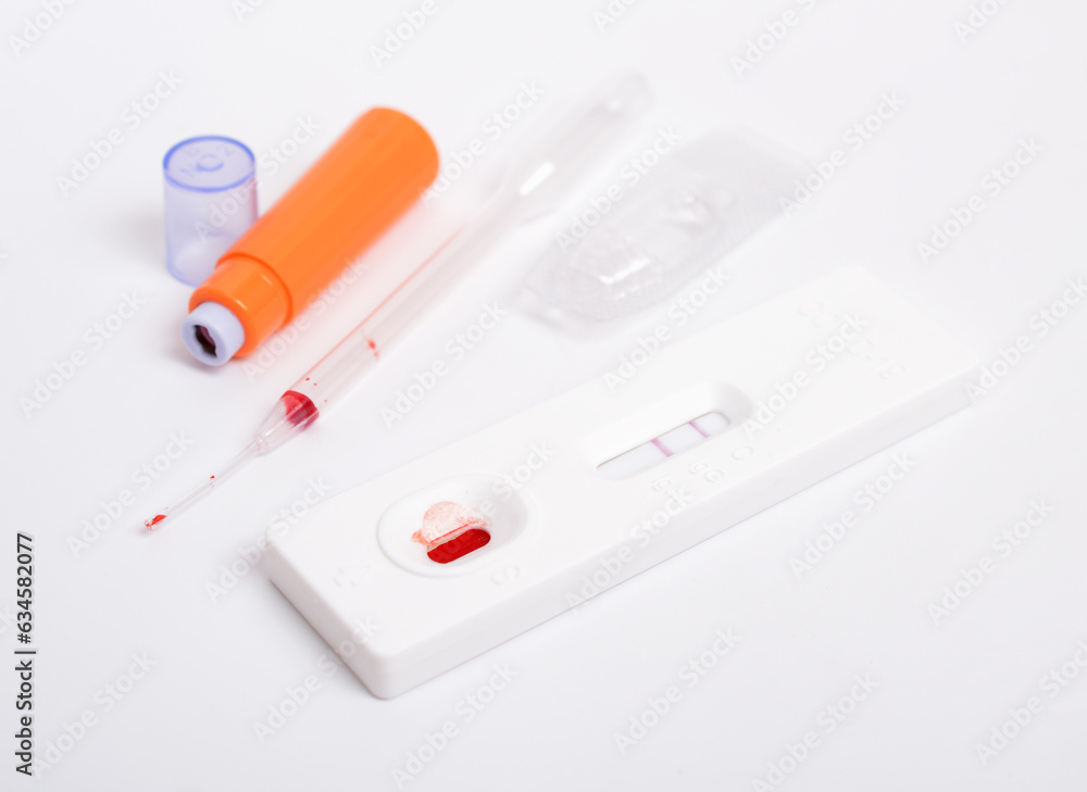 SARS COV 2 Antigen rapid test. Used, positive. On white background SARS COV 2 Antigen rapid test. Used, positive. On white background