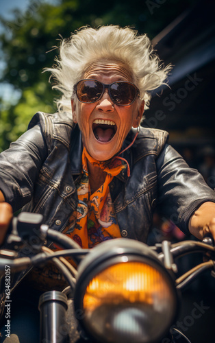 Joyful and youthful-looking elderly lady runs around on her motorcycle