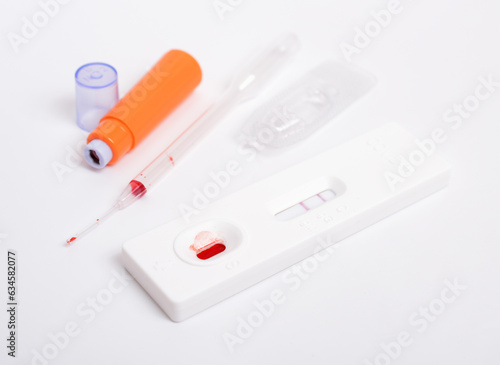 SARS COV 2 Antigen rapid test. Used, positive. On white background