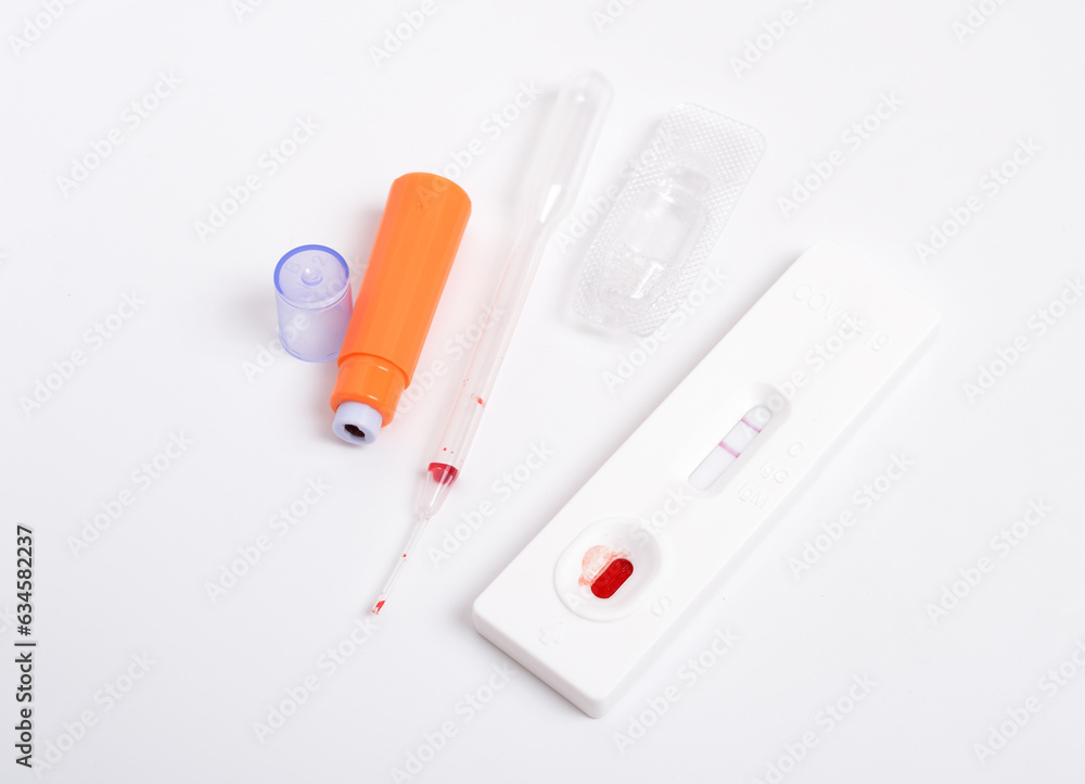 SARS COV 2 Antigen rapid test. Used, positive. On white background SARS COV 2 Antigen rapid test. Used, positive. On white background