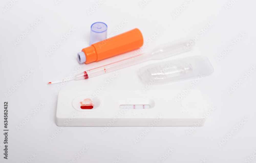 SARS COV 2 Antigen rapid test. Used, positive. On white background SARS COV 2 Antigen rapid test. Used, positive. On white background