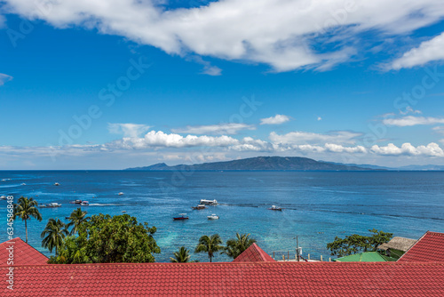 Rooftop view of boats in anchored in ocean, Haligi Beach, Puerto Galera, Mindoro, Philippines photo