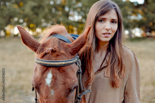 On a countryside meadow, a young woman shares a moment with her horse. Equestrianism, horseback riding, and horse-related sports offer a range of benefits, including nature-based relaxation.