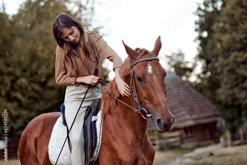 A woman is gently stroking a horse. Explore riding lessons at horse school, embrace horse therapy, and connect with animals for stress relief. Indulge in a nature weekend with emotional rewards.