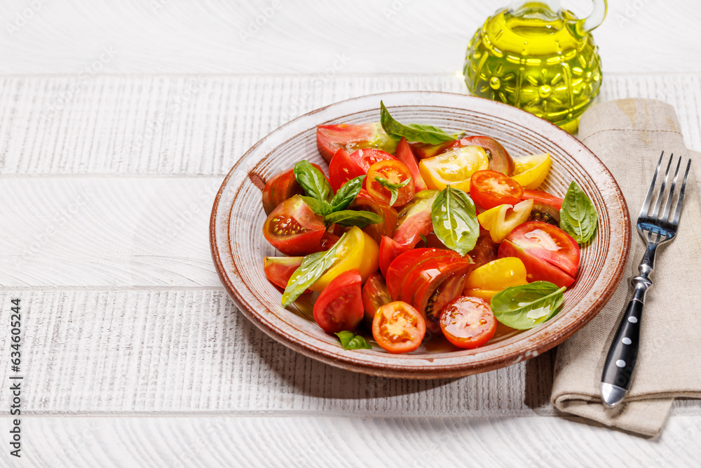 Tomato salad with fresh basil and olive oil Tomato salad with fresh basil and olive oil