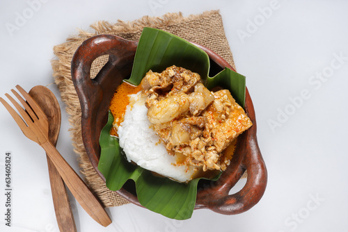 Tumpang Koyor is Indonesian Traditional Dish from Salatiga, made from Fatty Meat with Tempeh in Savory and Spicy Sauce, Served with Porridge. photo