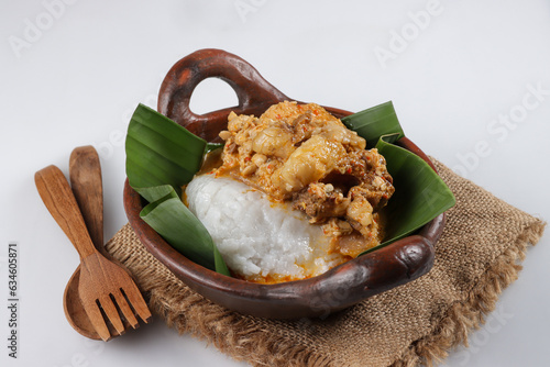 Tumpang Koyor is Indonesian Traditional Dish from Salatiga, made from Fatty Meat with Tempeh in Savory and Spicy Sauce, Served with Porridge. photo