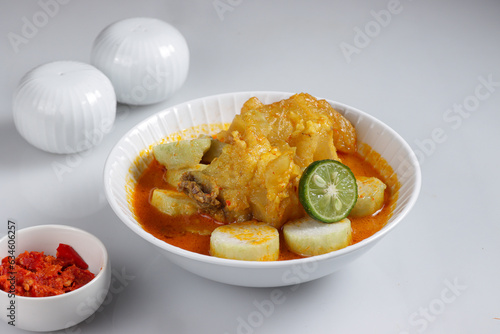 Lontong Kikil is Traditional Indonesian Food from Surabaya Jawa Timur, Made From Beef Legs and Rice Cake. photo