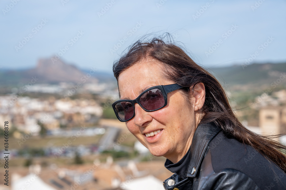 A happy woman looking to the old medieval town A happy woman looking to the old medieval town