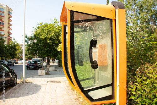 An old-fashioned telephone booth on a street in Vlora, Albania