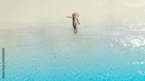 Fresh of summer with young woman  relaxation  as lying on the beach  in Maldives © SASITHORN