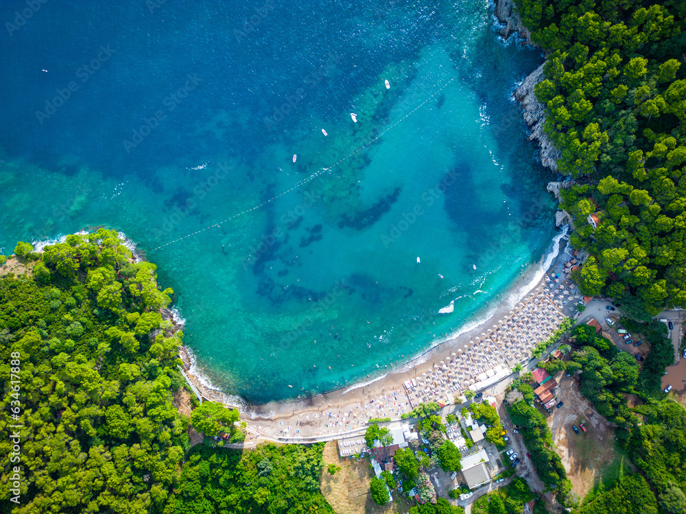 Luchica Beach Aerial View in Petrovac na Moru. Beaches and coastline of the Adriatic Sea at summer time. Natural landscapes of Montenegro. Balkans. Europe. 