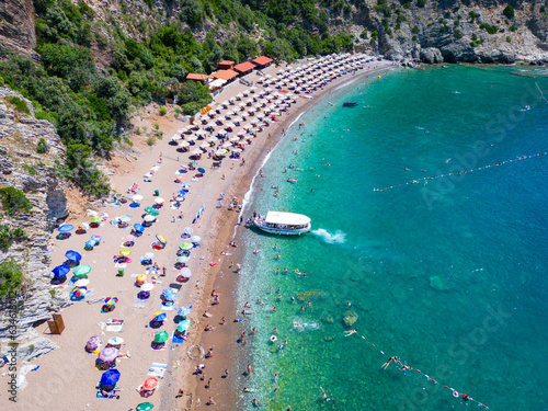 Queen's Beach ( Kraljichina Beach ) in Canj, Montenegro. Aerial view of paradise tropical beach, surrounded by green hills. Montenegro. Balkans. Europe. photo