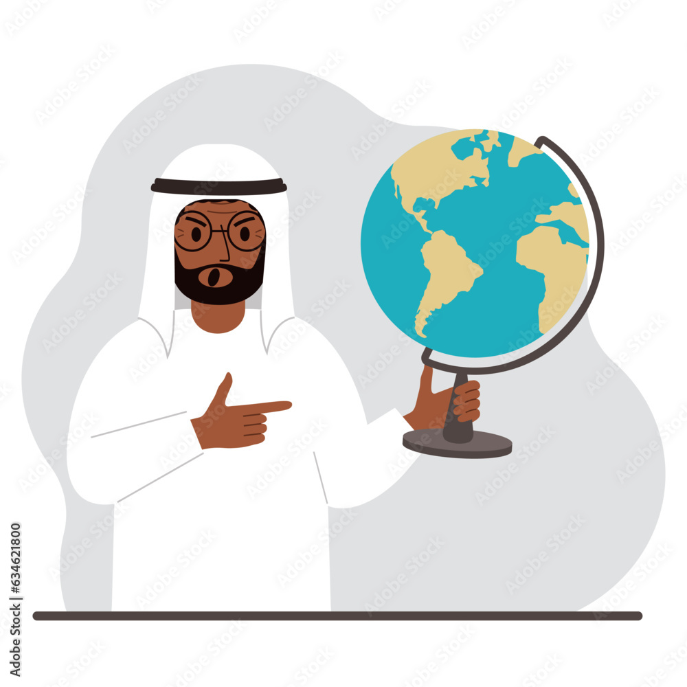 A muslim man holds a globe in his hand and points his finger at it. The concept of education, teacher, world conquest, ecology. A muslim man holds a globe in his hand and points his finger at it. The concept of education, teacher, world conquest, ecology.