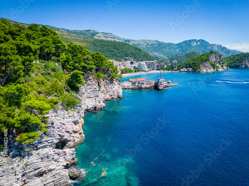 Petrovac na Moru Aerial View. Beaches and coastline of the Adriatic Sea at summer time. Natural landscapes of Montenegro. Balkans. Europe.