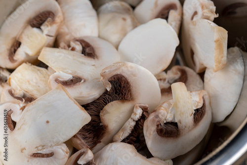 sliced mushrooms during cooking dishes with champignons