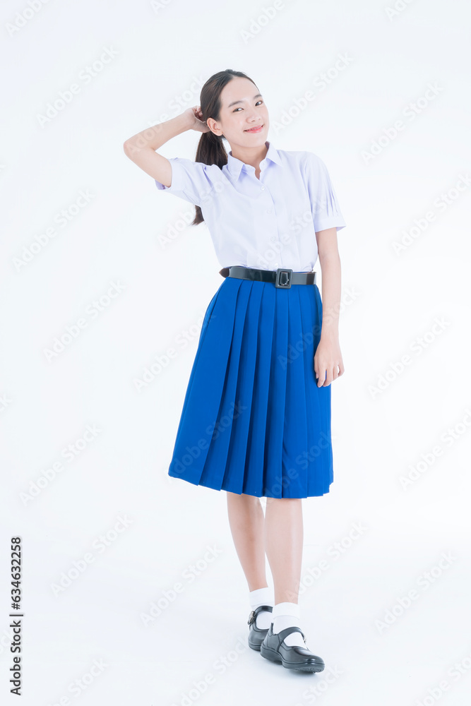 Back to school. Thai students. Studio shot of young Asian woman thinking. Girl with students uniform on white background. Back to school. Thai students. Studio shot of young Asian woman thinking. Girl with students uniform on white background.