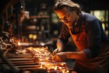 Glassblower manipulating molten glass - stock photography concepts