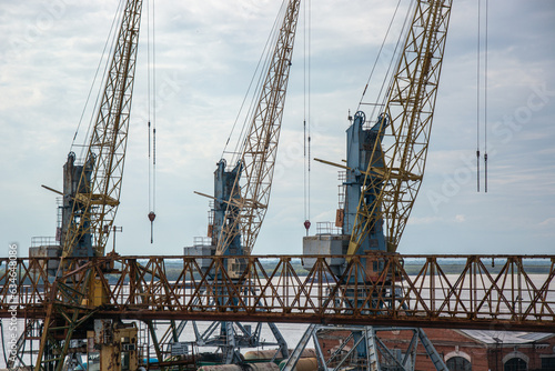 Large metal construction cranes at the docks