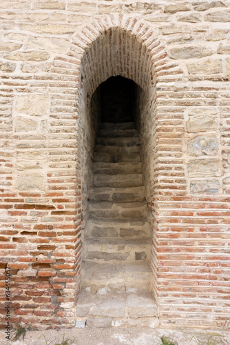 Fototapeta Naklejka Na Ścianę i Meble -  narrow entrance with stairs up to the castle