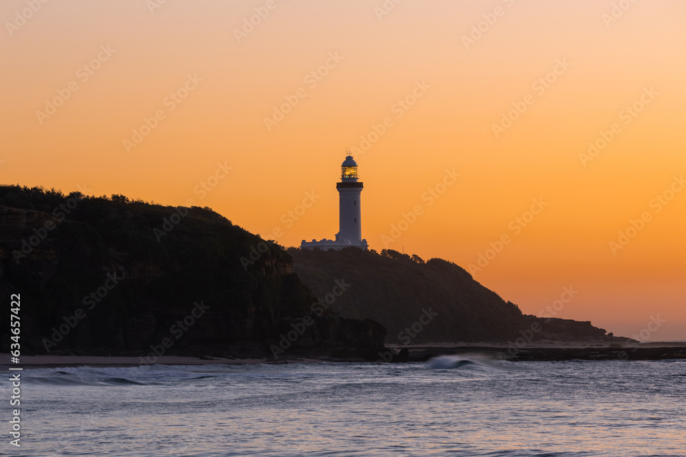 A warm sunrise view of Norah Head Lighthouse, NSW, Australia.