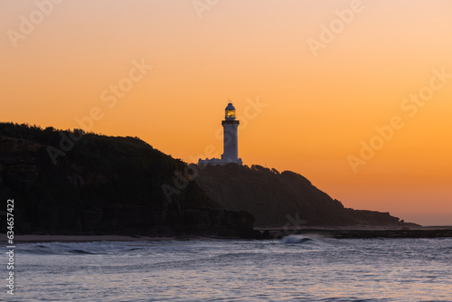 A warm sunrise view of Norah Head Lighthouse, NSW, Australia. © AlexandraDaryl