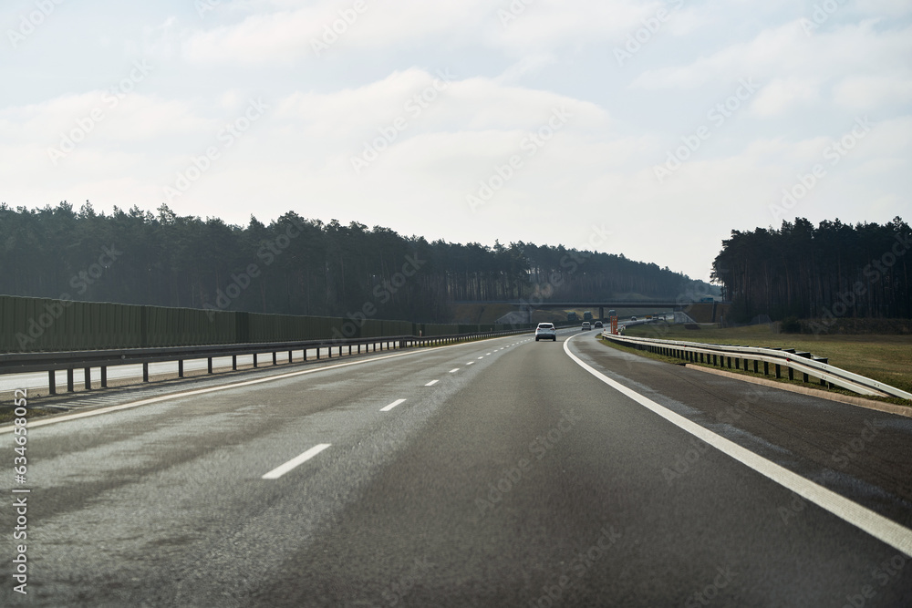 New A1 highway in Poland. The autostrada A1, officially named Amber Highway. View from the car on a road. New A1 highway in Poland. The autostrada A1, officially named Amber Highway. View from the car on a road.