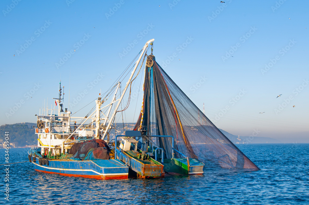 A fishing boat with a net.