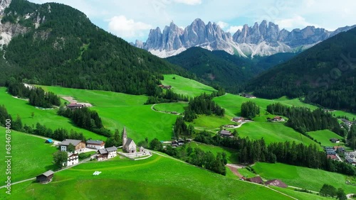 Santa Maddalena village and The Dolomites mountains in background, Val di Funes valley, Trentino Alto Adige region, Italy, Europe. photo