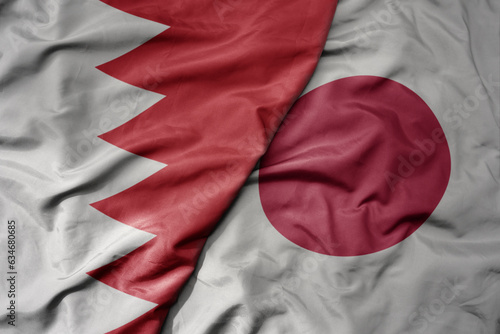 big waving realistic national colorful flag of bahrain and national flag of japan .