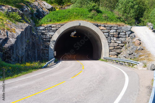 Road tunnel through the mountains. Norway tunnel through a high mountain in the north of the country. Car pass way
