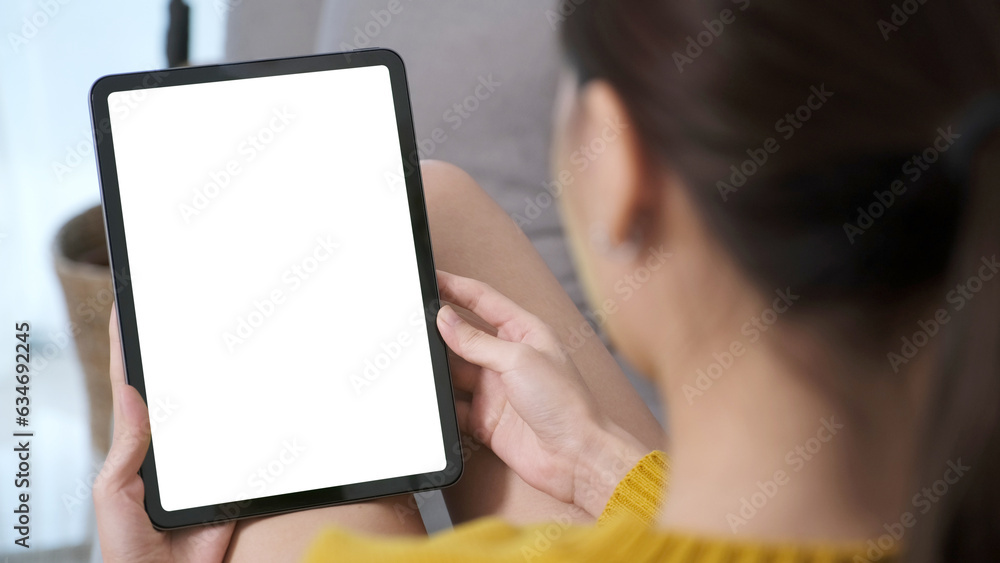 Woman hand using digital tablet with blank screen for mock up, template