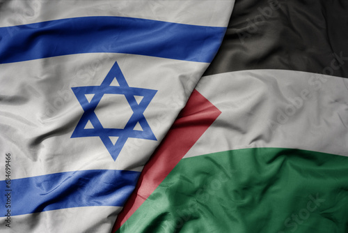 Obraz na plátně big waving realistic national colorful flag of israel and national flag of palestine