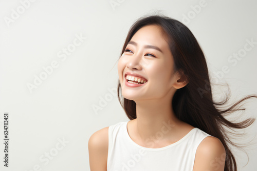  A close-up portrait of a stunning young Asian-Indian woman, smiling with pristine teeth. Used for a dental advertisement. Set against a white background. Composed using the rule of thirds. Gen. AI