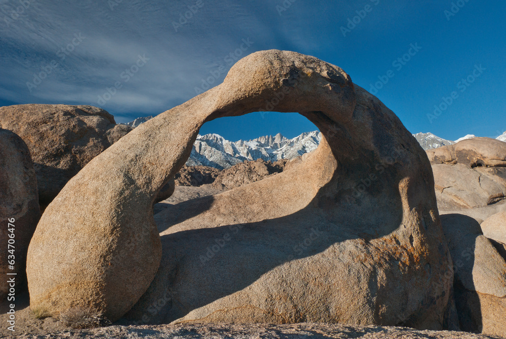 Lone Pine, California, United States –The Mobius Arch, a natural stone arch in the Alabama Hills, with Mt. Whitney and the Eastern Sierras in the background. Lone Pine, California, United States –The Mobius Arch, a natural stone arch in the Alabama Hills, with Mt. Whitney and the Eastern Sierras in the background.