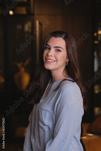 Smiling young woman in living room